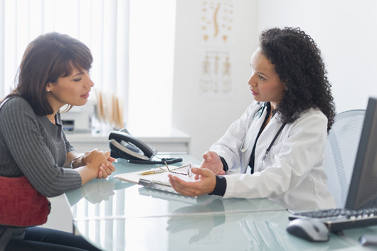 Image of patient and doctor in office