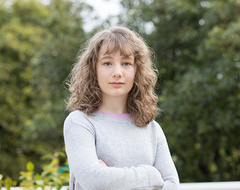 Girl with arms folded